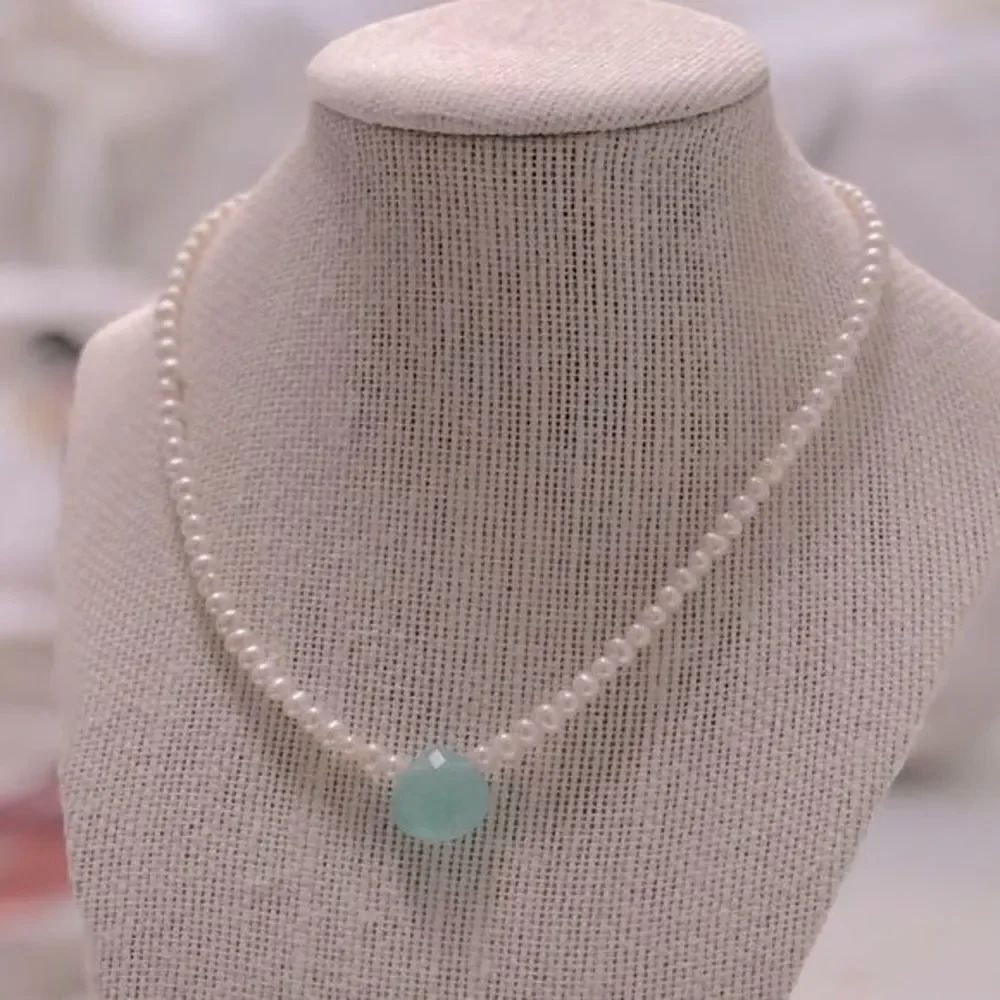 Handmade Pearl-like beaded strand with turquoise colored focal bead